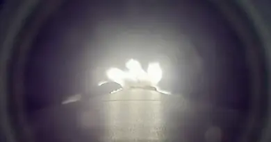 a downward-facing camera mounted on a rocket captures the booster's thrust as it climbs to space