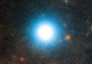 A bright glowing blue star in the middle of a starry solar system is Alpha Centauri