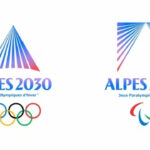 Les emblèmes des Jeux Alpes 2030 dévoilés, inspirés par la lumière sur une montagne.