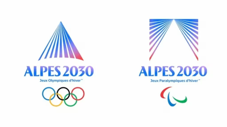 Les emblèmes des Jeux Alpes 2030 dévoilés, inspirés par la lumière sur une montagne.
