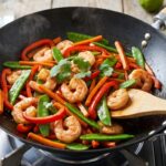 Crevettes sautées au wok : une recette simple et rapide pour les amateurs de cuisine asiatique.