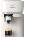 Philips présente sa machine à expresso Baristina avec broyeur intégré et réservoir double.