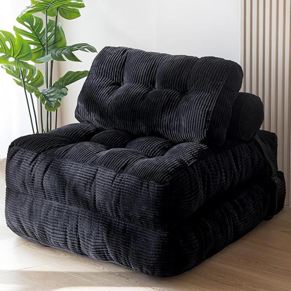 Sofa sectionnel convertible avec compression par aspiration, disponible en noir.