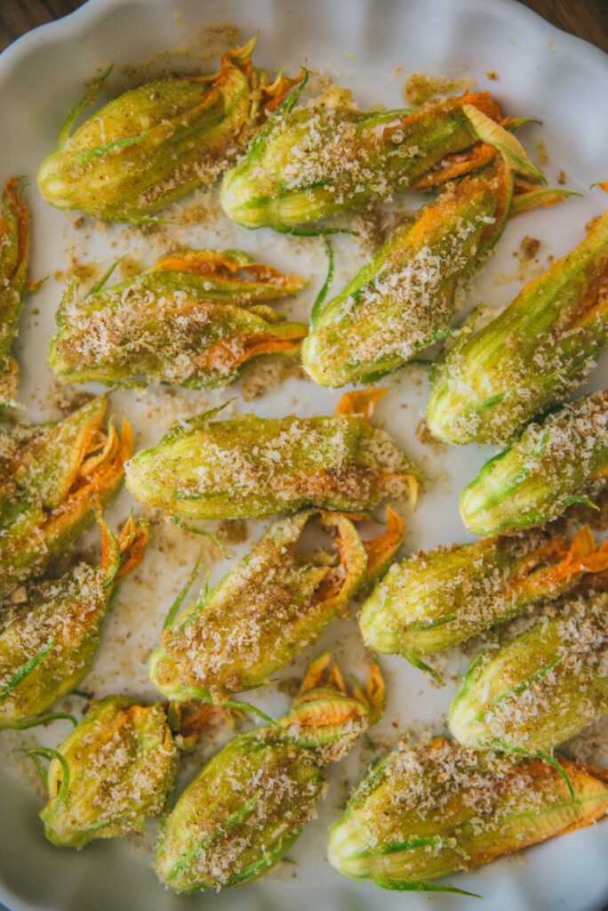 Fleurs de courgettes farcies à la ricotta : une recette traditionnelle italienne au four.