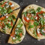Recette de pizza sur pain naan : une alternative rapide et simple pour les repas.